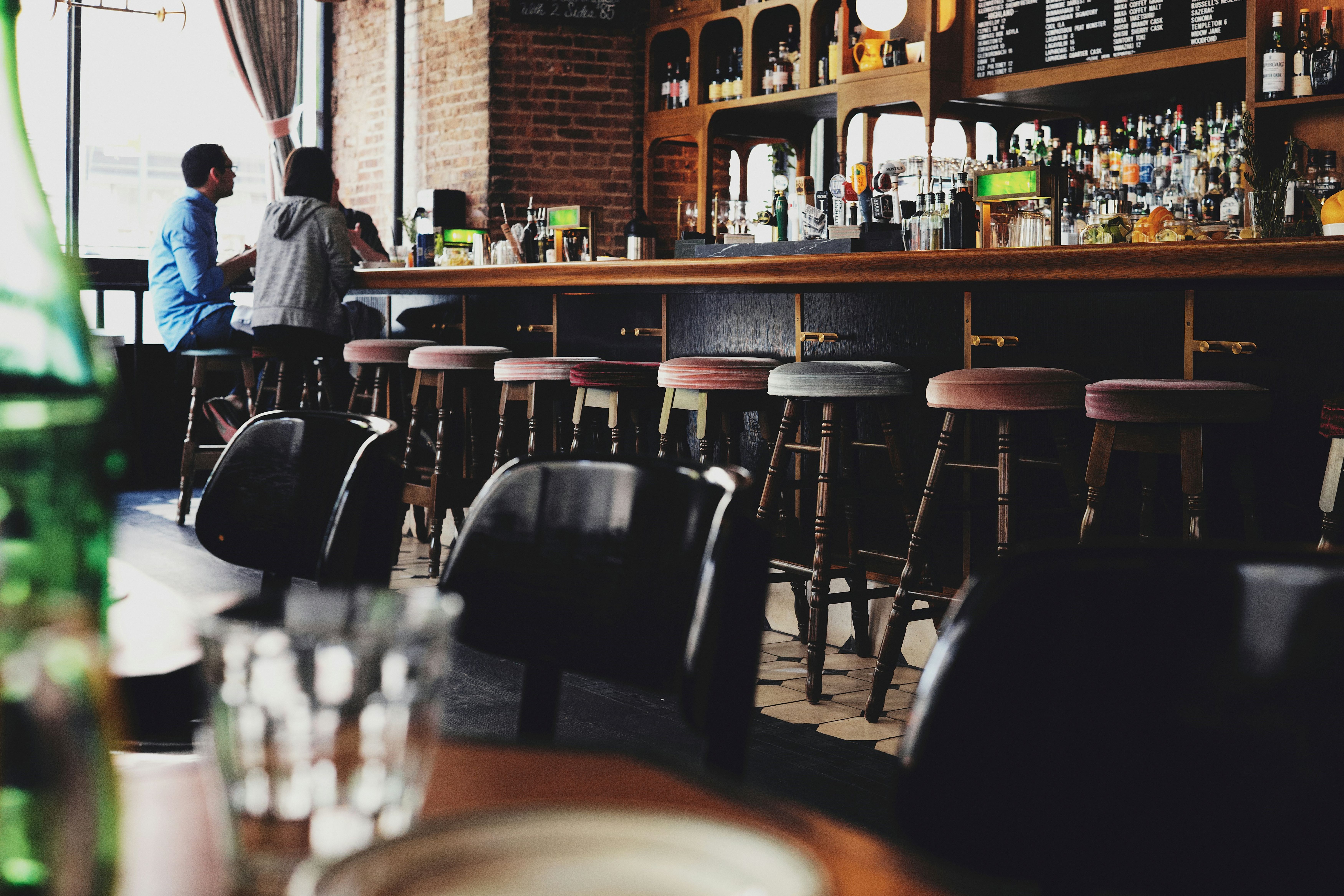 A bar with chairs.