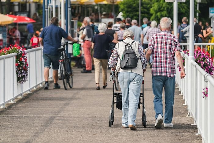 Older people walking on bridge